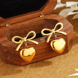 Heart pendant bow earring in gold