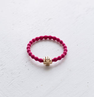 Wave hair tie with gold clover charm in hot pink