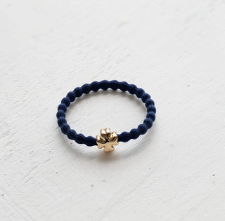 Wave hair tie with gold clover charm in navy